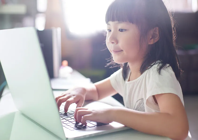 Students engaged in online learning with certified teachers